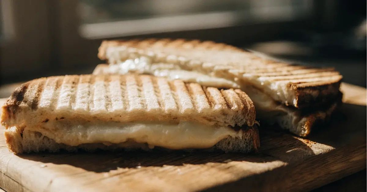 Grilled cream cheese sandwich close-up on cutting board