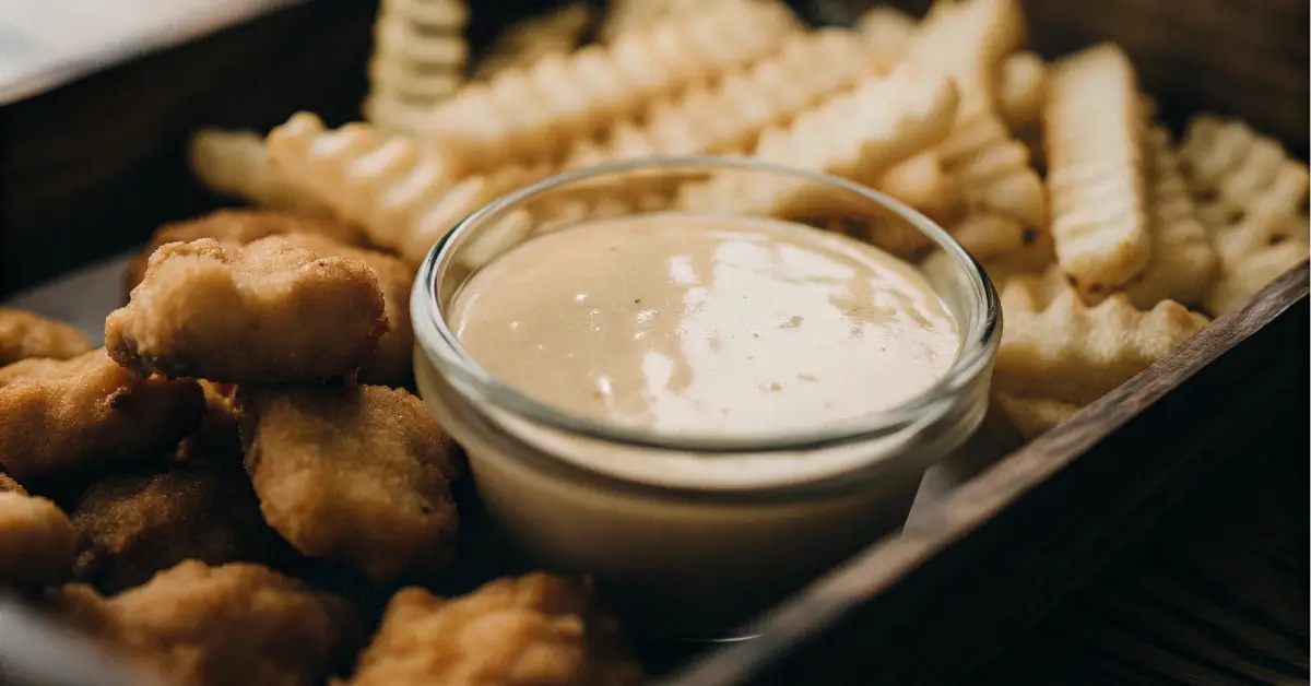 homemade Chick-fil-A sauce with nuggets and fries
