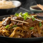 Chow fun noodles with beef and green onions