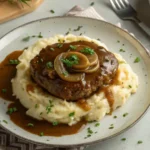 Easy Salisbury steak recipe with gravy on mashed potatoes