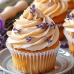 Lavender honey cupcakes with floral honey drizzle on rustic tray