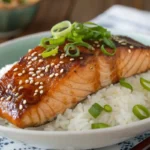Teriyaki salmon and rice recipe with sesame garnish