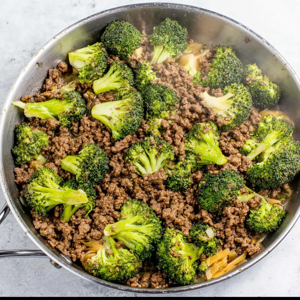Plated Keto Hamburger Broccoli Skillet with avocado and salad
